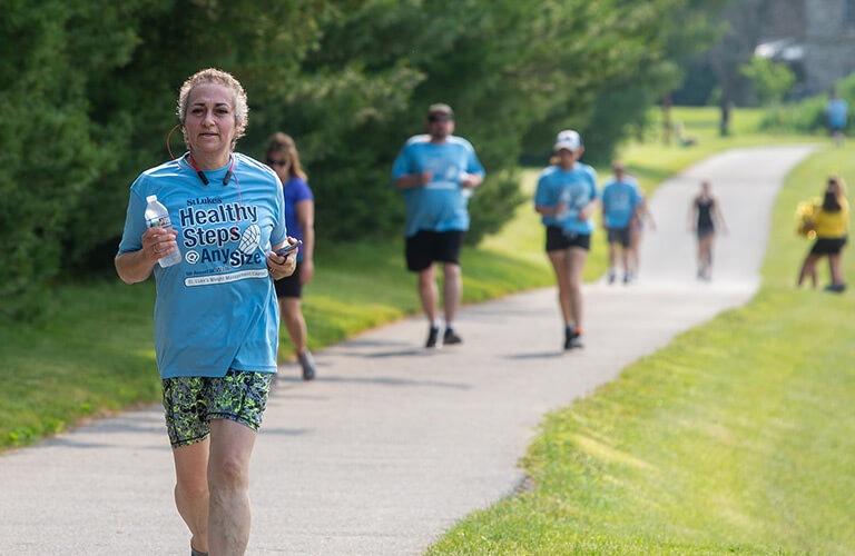 Runners jogging on an outdoor path